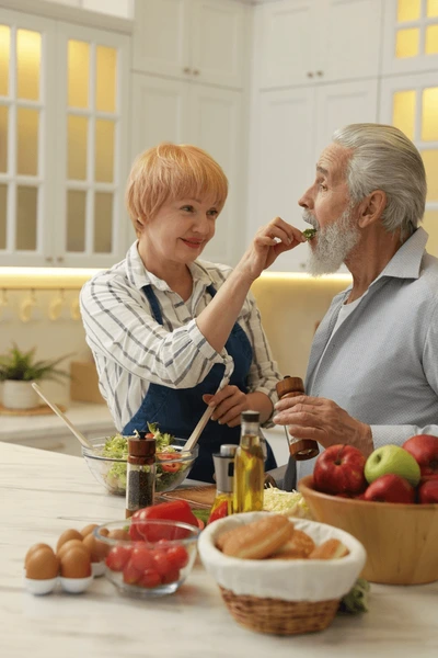 senior-couple-feeding-each-other-600nw-2660753343